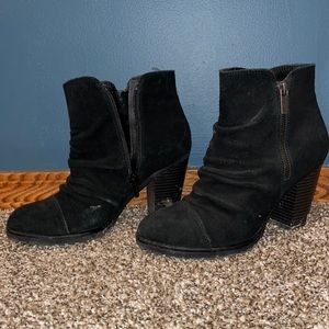 Size 8 female, black boot heels.